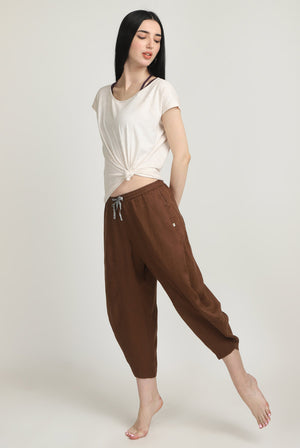 Woman in 100% Linen Brown Yoga Pants and Tie Top