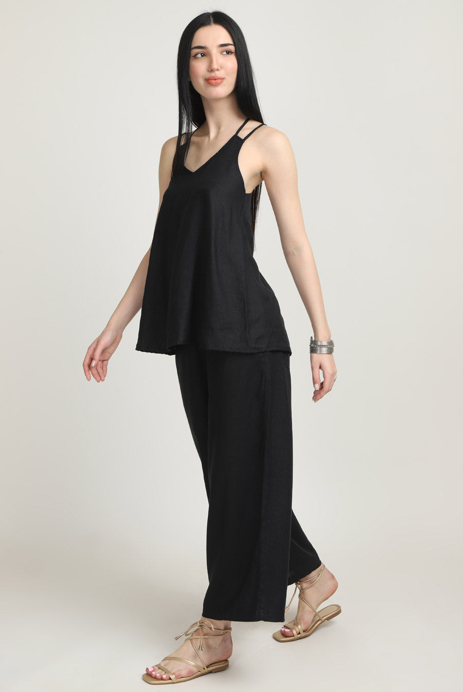Girl in black strap top and black 100% linen pants